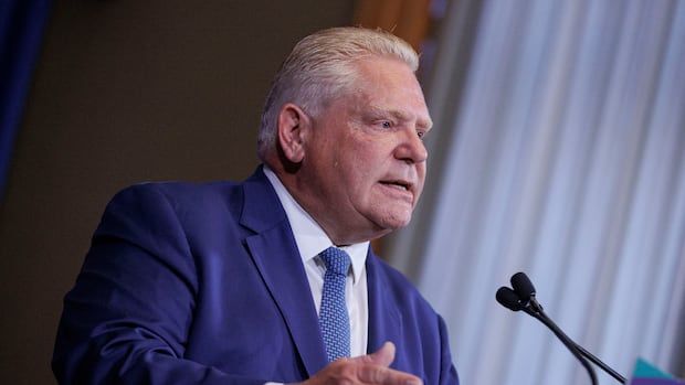 Premier Doug Ford standing at a podium at Queen's Park speaking to reporters. 