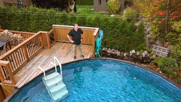 man looking at pool