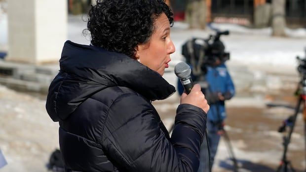 a woman attends a rally