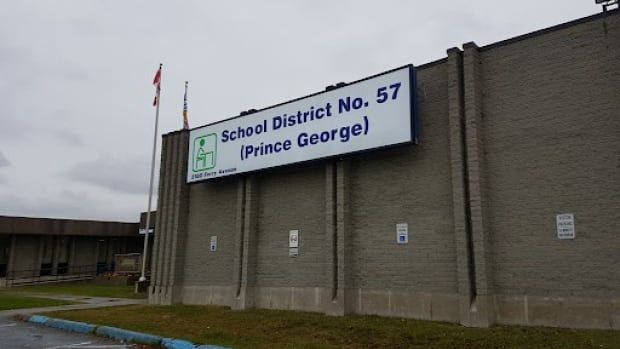 A white sign on a tall building that reads 'School District No. 57 (Prince George).'