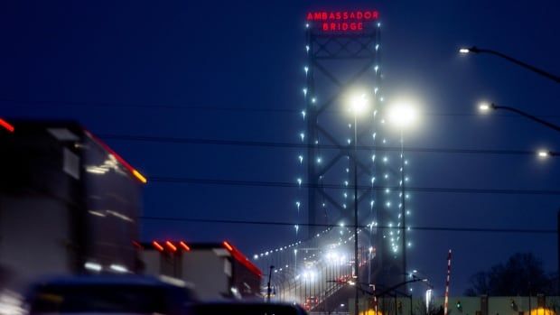 A bridge is seen at night