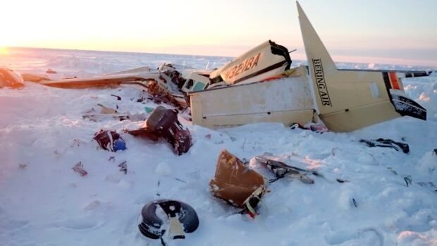 Remnants of a crashed airplane in the snow.