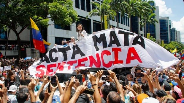 Opposition leader Maria Corina Machado leads a protest against the reelection of President Nicolás Maduro one month after the disputed presidential vote in Caracas, Venezuela on Wednesday, Aug. 28, 2024.