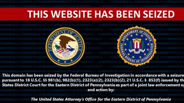 A screengrab from a website features a banner reading "this website has been seized" above two logos for the U.S. Department of Justice and the F.B.I. 