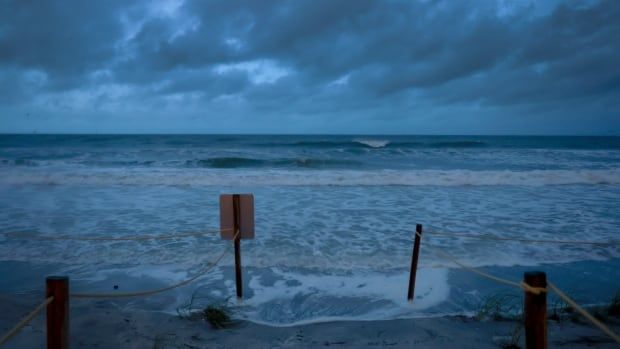 The Gulf of Mexico's water pushes up against the beach as Hurricane Helene churns offshore on September 26, 2024 in St. Pete Beach, Florida. 