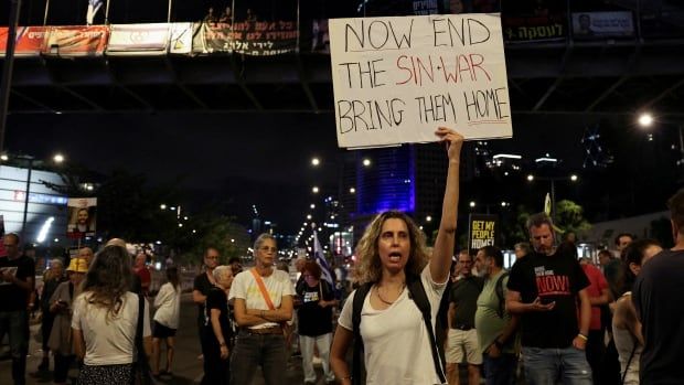 A demonstrator holds a sign with a reference to Hamas leader Yahya Sinwar, after Israeli military said they have killed him, as families and supporters of hostages kidnapped during the deadly October 7, 2023 attack, protest against the government and to demand their immediate release, amid the ongoing conflict in Gaza between Israel and Hamas, in Tel Aviv, Israel, October 17, 2024. REUTERS/Violeta Santos Moura