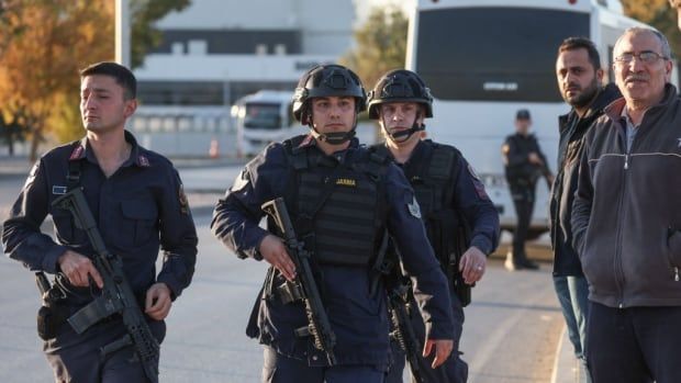 Members of Turkey's national gendarmerie force hold weapons. 