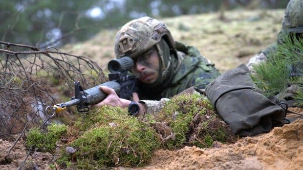 Corp. Guillaume Lavoie and Corp. Matthew Bowler from Quebec show a defensive position in a trench during Resolute Warrior military exercises in Latvia.