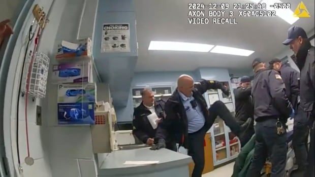 An image taken from bodycam footage shows correction officer beating a person.