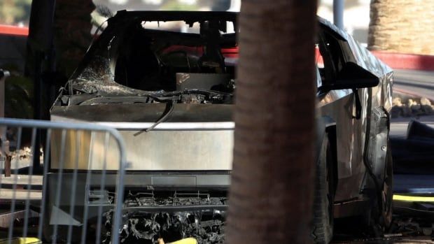 The remains of a Tesla Cybertruck that burned at the entrance of Trump Tower is pictured.