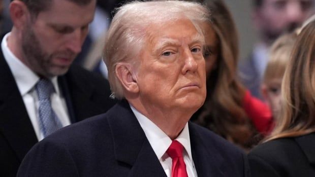 U.S. President Donald Trump sits during a prayer service in Washington, D.C.