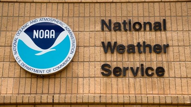 Sign that says 'NOAA National Weather Service' on the wall of a building