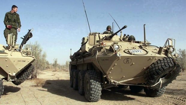 FILE--A Canadian Armed Forces Coyote armoured surveillance vehicle drives at Kandahar Airbase in Kandahar, Afghanistan Tuesday February 5, 2002.  Twenty-six-year-old Trooper Richard Renaud of Alma Quebec, a member of the 12e Regiment blinde du Canada, was killed in a blast Tuesday, Jan.15, 2008 involving a Coyote light armoured vehicle. THE CANADIAN PRESS/Kevin Frayer