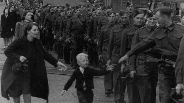 This photograph was taken by a Vancouver Daily Province staff photographer on Oct. 1, 1940 as the British Columbia Regiment marched down Eighth Street in New Westminster, before embarking overseas to join the Second World War effort. The photograph subsequently became famous the world over. 