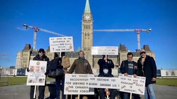 A group of Afghan-Canadians, who served as language and cultural advisors during the Afghan War, hold a demonstration on Nov. 12 in Ottawa.