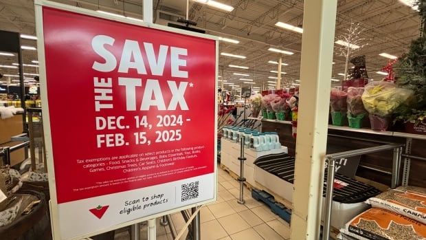 A sign at the entrance of a store says "save the tax: December 14, 2024 to February 15, 2025". 