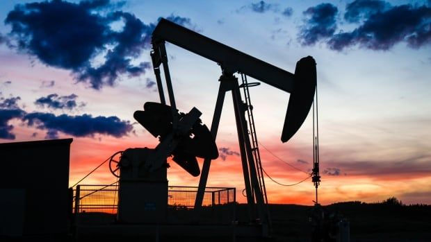 A pumpjack draws out oil from a well head near Calgary in September. Alberta's rural municipalities are still waiting on their significant unpaid outstanding property taxes to be paid.