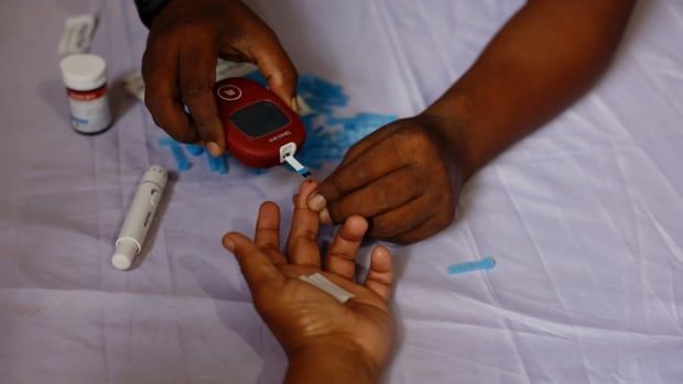 A person receives a free blood sugar test during a campaign to mark the World Diabetes Day in Dhaka, Bangladesh, on Nov. 14, 2024.