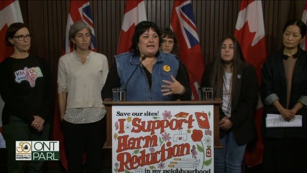 Zoe Dodd, member of Toronto Overdose Prevention Society, speaks to reporters at Queen's Park on Monday after the Ontario government has tabled a bill that would close 10 supervised consumption sites because they are considered too close to schools and daycares.