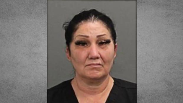 Brigitte Cleroux looks neutral in a mugshot. She is an Indigenous woman wearing black.