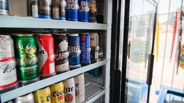 Cold beer fills the fridge of Fresh and Fast Food Mart on Richmond Street in London, Ont., on Sept. 13, 2024. 