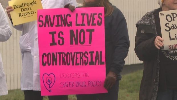 A bright pink sign that says saving lives is not controversial.