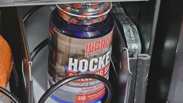 A bottle labelled 'hockey smelling salts' in a vending machine.