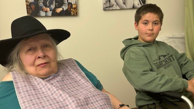 Myrna Foat, shown here during a visit with her grandson Dylan at her care home last year, died in December. She and her family would have preferred to have cared for her at home but found it impossible with limited access to home care.  