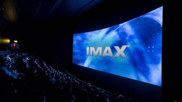 A large theatre screen is shown. It bears the word 'IMAX'