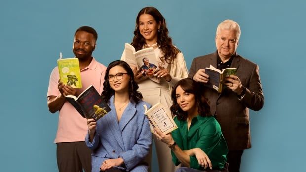 A black man wearing a pink shirt holds a yellow book. An Asian woman wearing a blue blazer holds and navy book. An Indigenous woman wearing a white blouse holds a colourful book. A Chilean woman wearing a green blouse holds a beige book. A white man wearing a brown sports coat holds a green book.