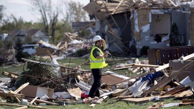 David Sills is seen here on September 22, 2018 surveying damage from a tornado in Dunrobin, Ont. Sills is an atmospheric scientist and the executive director of the Northern Tornadoes Project at Western University. 