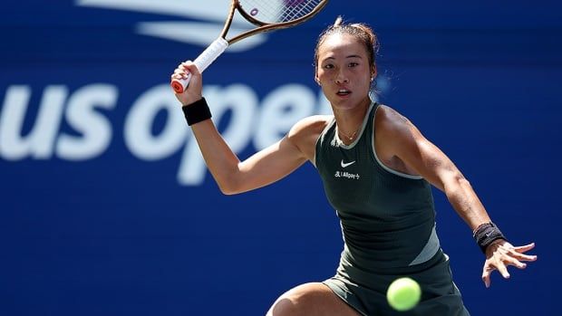 Zheng Qinwen of China returns against Amanda Anisimova of the United States during their first-round women's singles match on Day 1 of the U.S. Open at the USTA Billie Jean King National Tennis Center on Aug. 26, 2024 in New York.