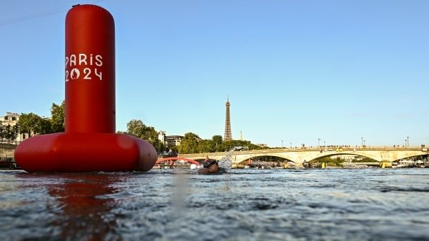 A buoy is seen on the water.