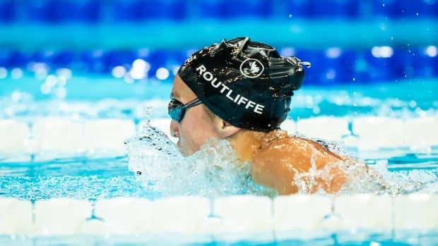 A Paralympic swimmer competes in an individual medley race.