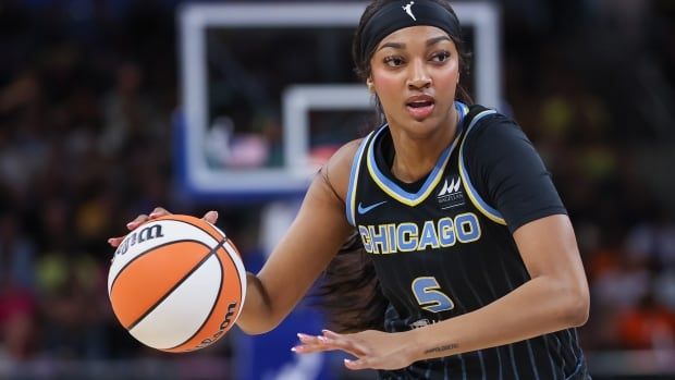 Chicago Sky female basketball player brings the ball up court during the game against the Indiana Fever at Wintrust Arena on August 30, 2024 in Chicago, Illinois.