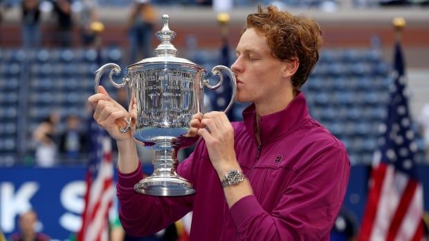 Italian male tennis player celebrates with the winners trophy in the men's singles final on Day Fourteen of the 2024 US Open at USTA Billie Jean King National Tennis Center on September 08, 2024 in the Flushing neighborhood of the Queens borough of New York City. (Photo by Sarah Stier/Getty Images)