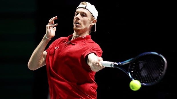 Canada's Denis Shapovalov returns a shot in his men's singles match against Finland's Eero Vasa at the Davis Cup Final on Sept. 12, 2024 in Manchester, England.