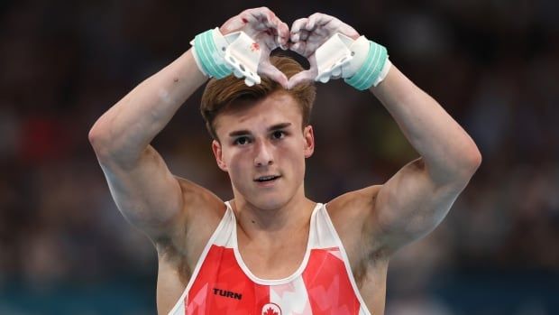 Felix Dolci of Team Canada reacts after falling on the high bar during the Artistic Gymnastics Men's All-Around Final.