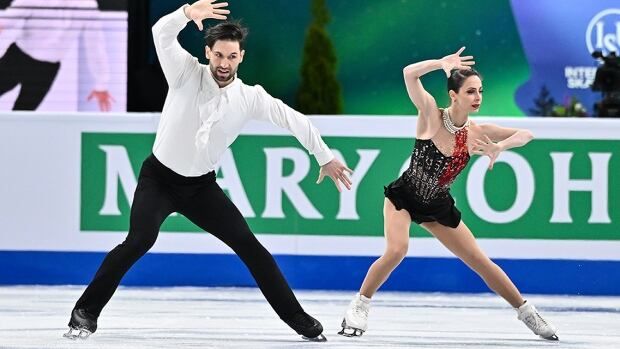 The Canadian pairs figure skating team of Deanna Stellato-Dudek and Maxime Deschamps compete in the free program during the world championships at th