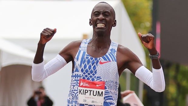 Kenyan runner Kelvin Kiptum celebrates as he crosses the finish line to win the Chicago Marathon professional men's division and set a world record marathon time of two hours 35 seconds 2:00.35 on Oct. 8, 2023 in Chicago, Illinois.