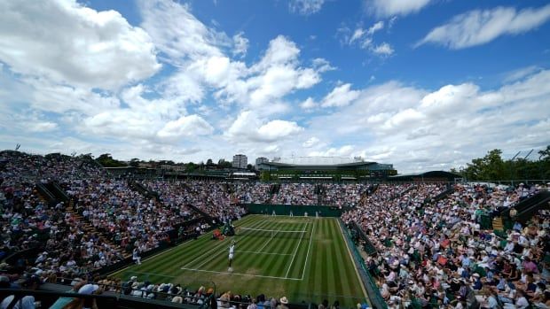 A tennis court is seen during a game.