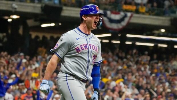 A men's baseball player celebrates a home run.