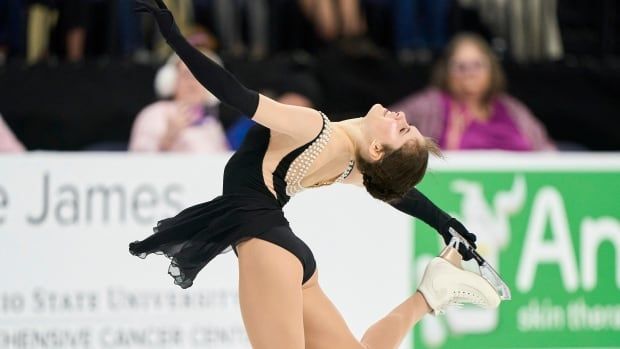 A women's figure skater skates her program.