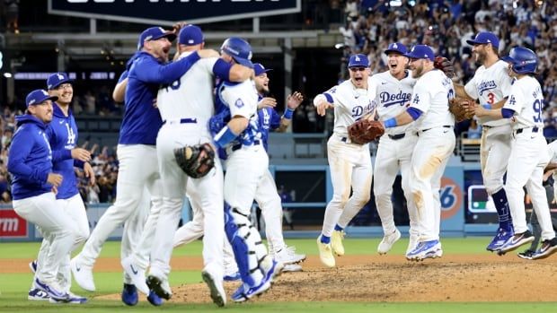 A baseball team celebrates.