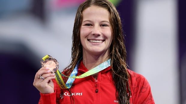 Canadian athlete Caeli McKay, who earned diving bronze at the 2022 Commonwealth Games, poses with her medal after the women's 10-metre platform final in Birmingham, England on Aug. 4, 2022. 