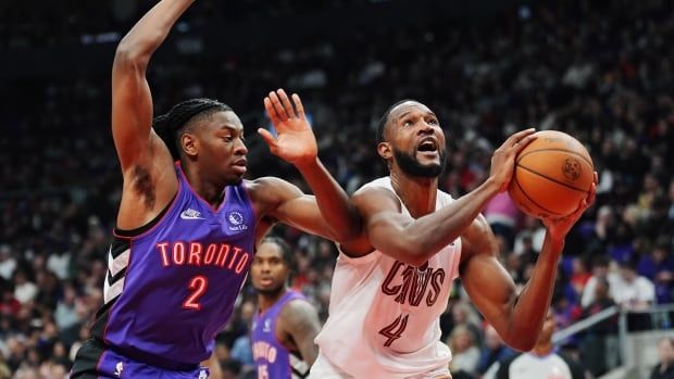 A men's basketball player is fouled.