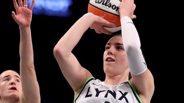 Canadian women's basketball player Bridget Carleton of the Minnesota Lynx takes a shot as New York Liberty's Sabrina Ionescu defends in Game 5 of the WNBA Finals at Barclays Center on Oct. 20, 2024 in the Brooklyn borough of New York City.