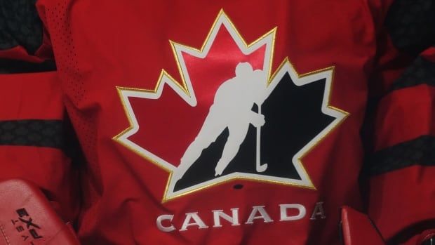 A red Hockey Canada jersey is pictured.