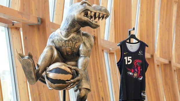 The Toronto Raptors’ "City Edition" jersey and sculpture, inspired by Vince Carter's 2000 NBA slam dunk contest performance, are displayed at the Art Gallery of Ontario in Toronto on Nov. 13, 2024.