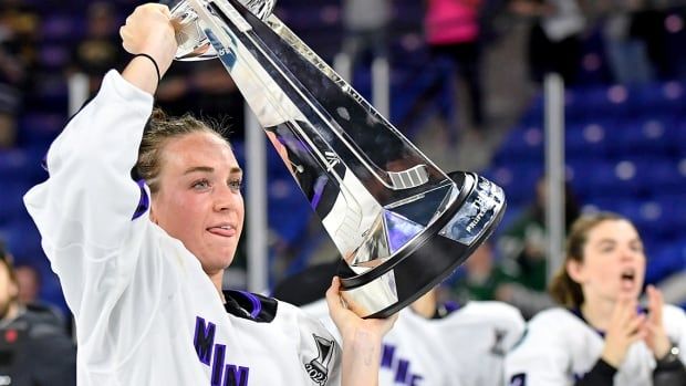 Minnesota Frost forward Taylor Heise celebrates with the Walter Cup after defeating Boston in Game 5 of the PWHL Finals at Tsongas Center in Lowell, Massachusetts on May 29, 2024. 